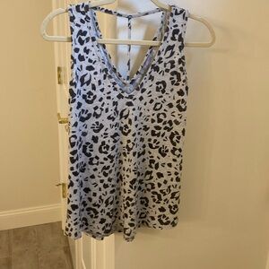 Strappy tank w/the softest fabric.Tart brand bought @ boutique XS fits like a S